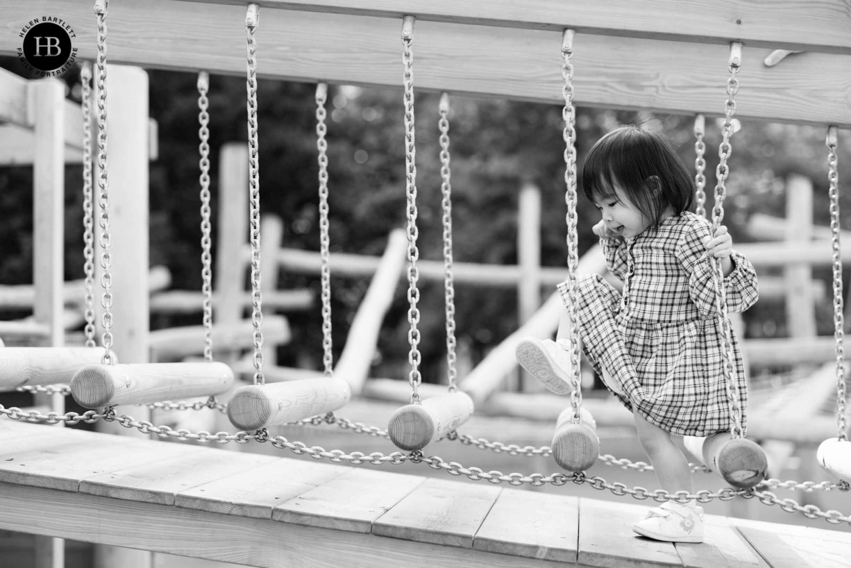 action shot of a child playing in the playground on the Southbank, shot in black and white