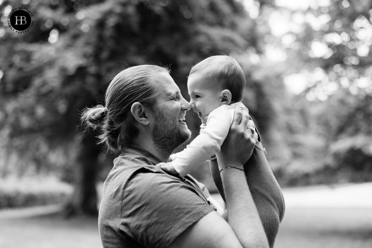 portrait of dad and baby nose to nose by hampstead heath photographer Helen Bartlett