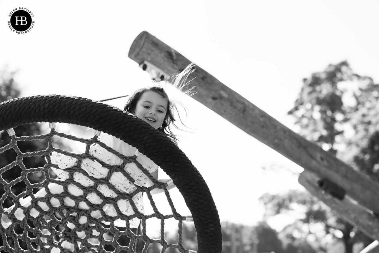 little girl plays on the swings at weald country park in brentwood