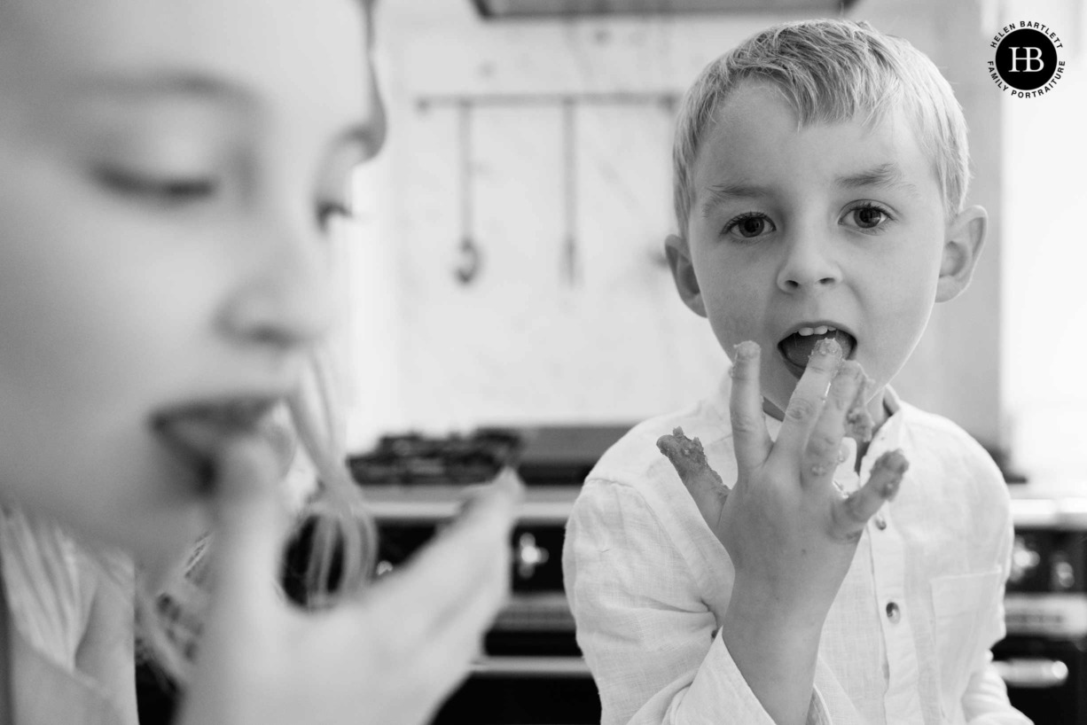 children-lick-fingers-while-baking-cookies