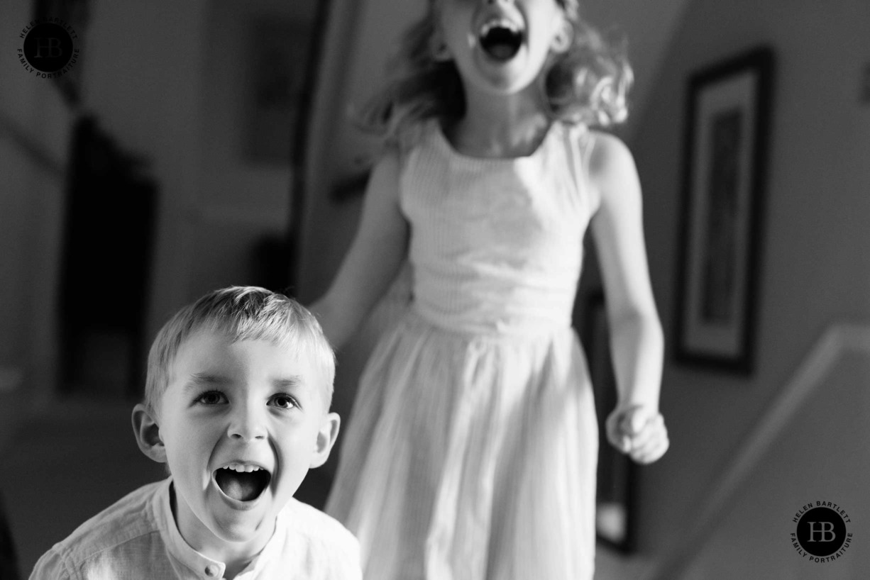 children-jump-for-joy-on-family-photo-shoot