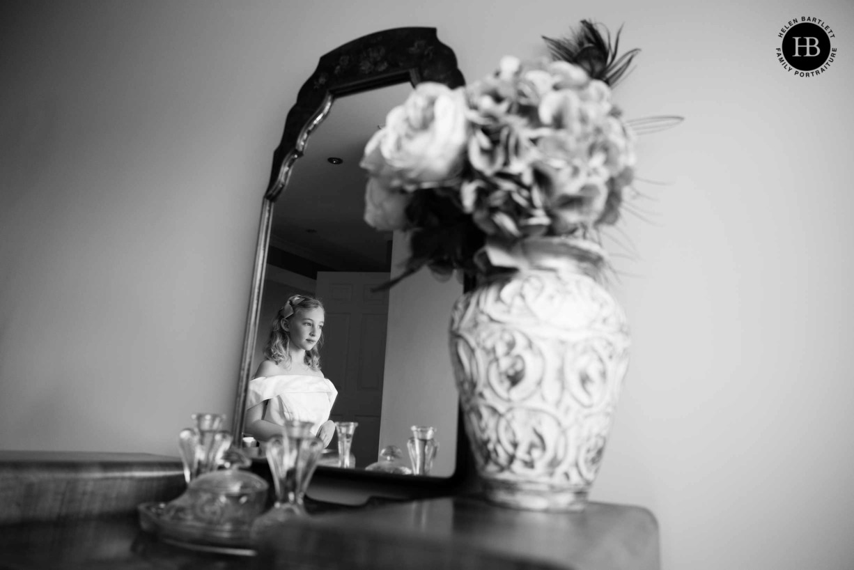 little-girl-dressed-as-bride-reflected-in-mirror