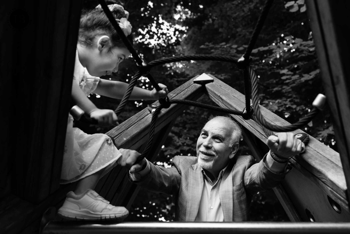 girl-talks-grandfather-while-playing-climbing-frame