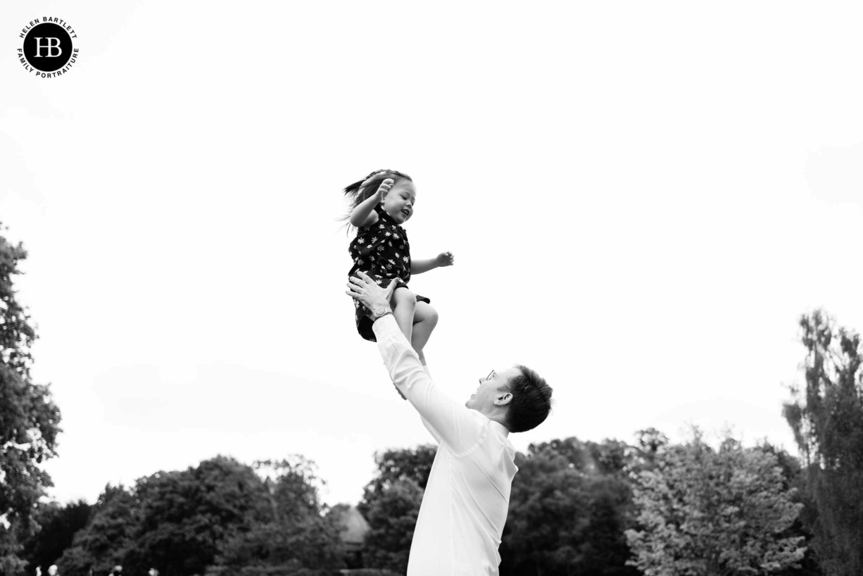 little-girl-thrown-in-air-by-father