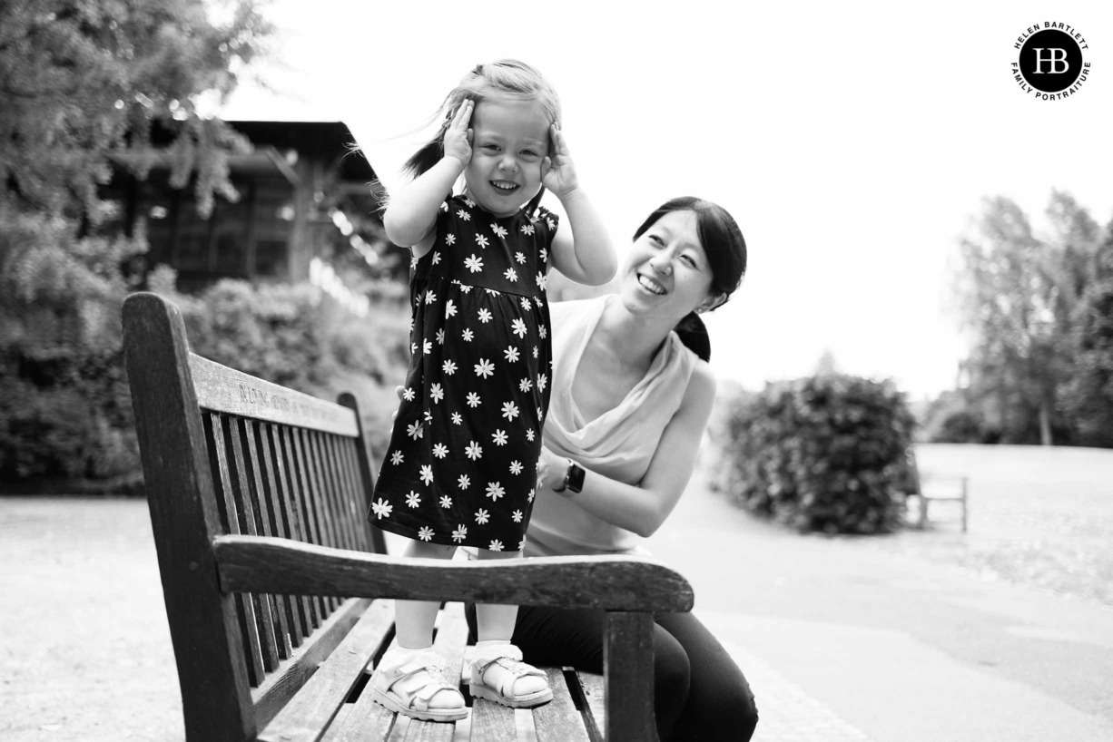 mum-and-daughter-play-hide-and-seek-golders-hill-park