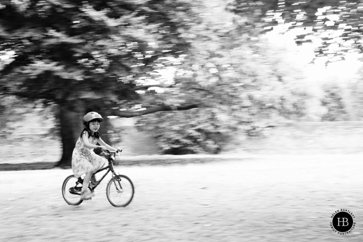 panning-shot-child-on-bike-family-photoshoot