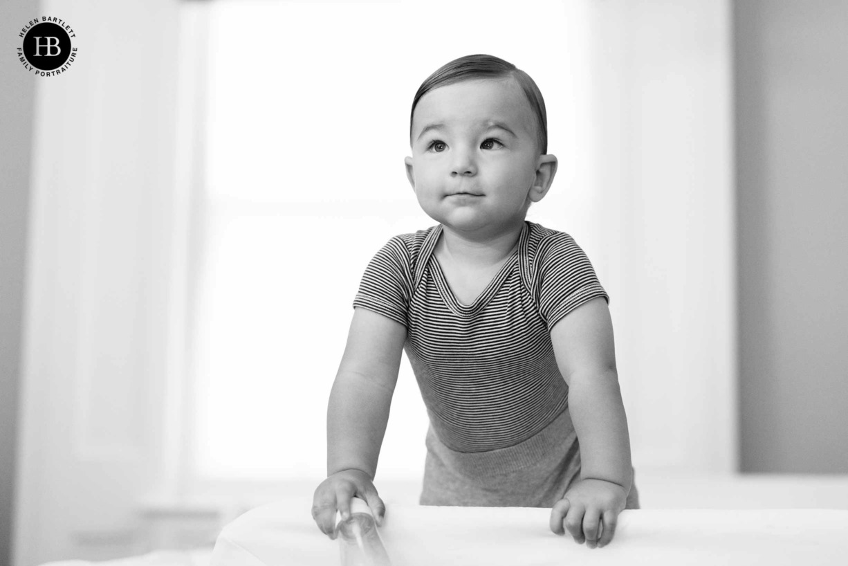 baby-stands-on-parents-bed