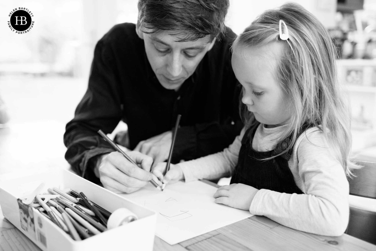 dad-helps-daughter-with-drawing