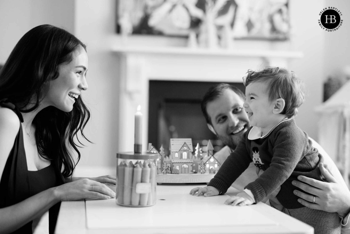 baby-looks-advent-candle-family-laughing