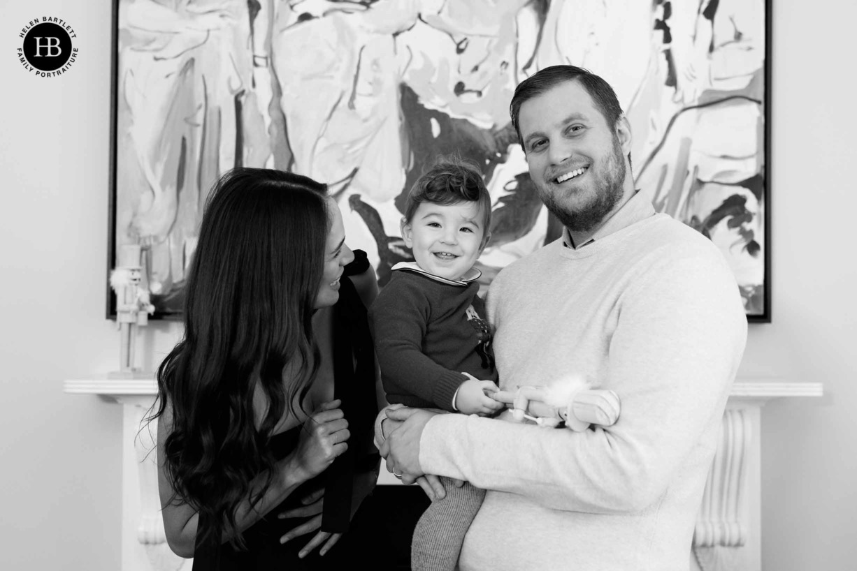 family-in-front-of-painting-with-nutcracker-toy