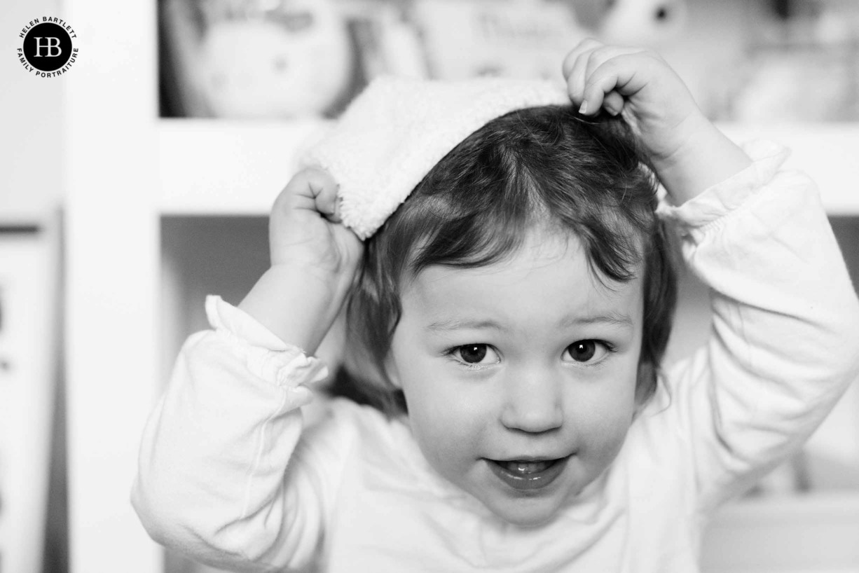 little-girl-puts-on-christmas-hat