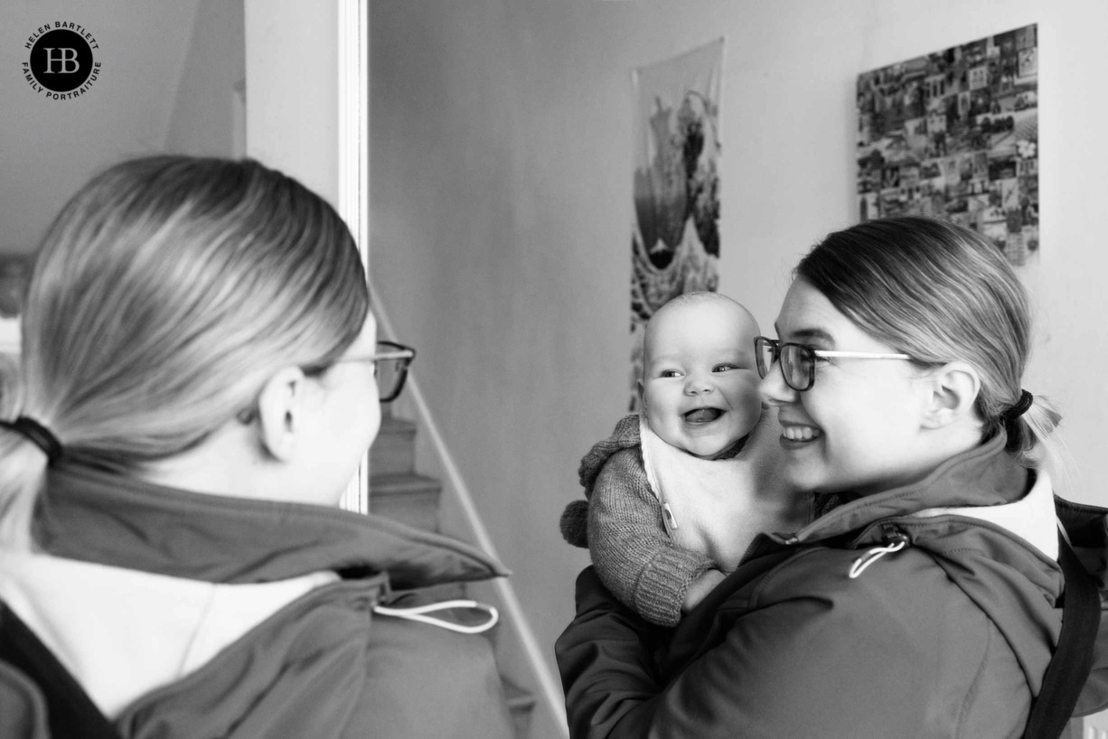 baby-laughs-at-reflection-of-self-in-the-mirror