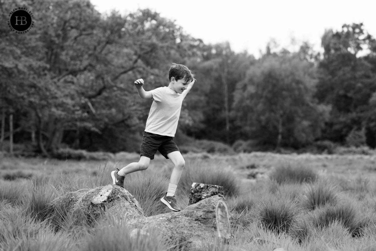 boy-plays-in-woodland-on-wimbledon-common-london