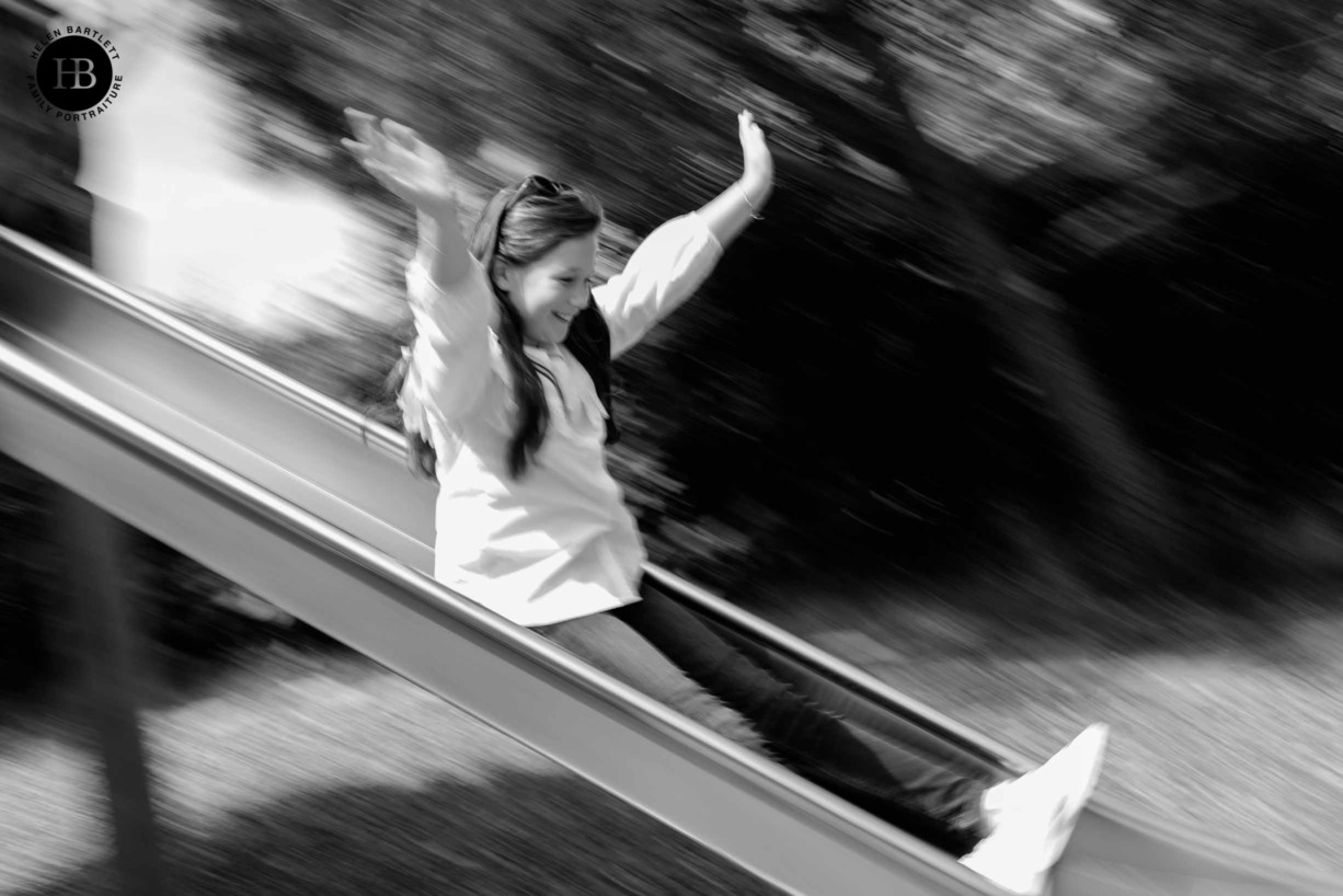 girl-plays-slide-joyful-shot-showing-motion