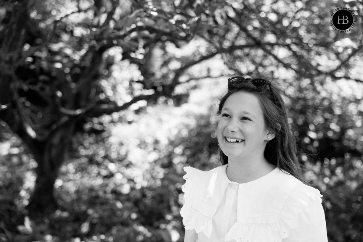 laughing-portrait-young-girl-black-and-white-wisley-surrey