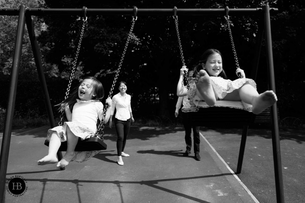 children-play-on-swings-primrose-hill-playground