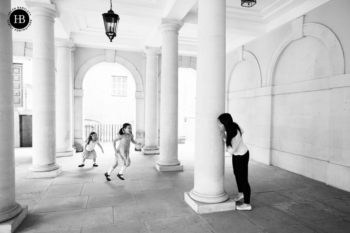 family-playing-hide-and-seek-among-pillars