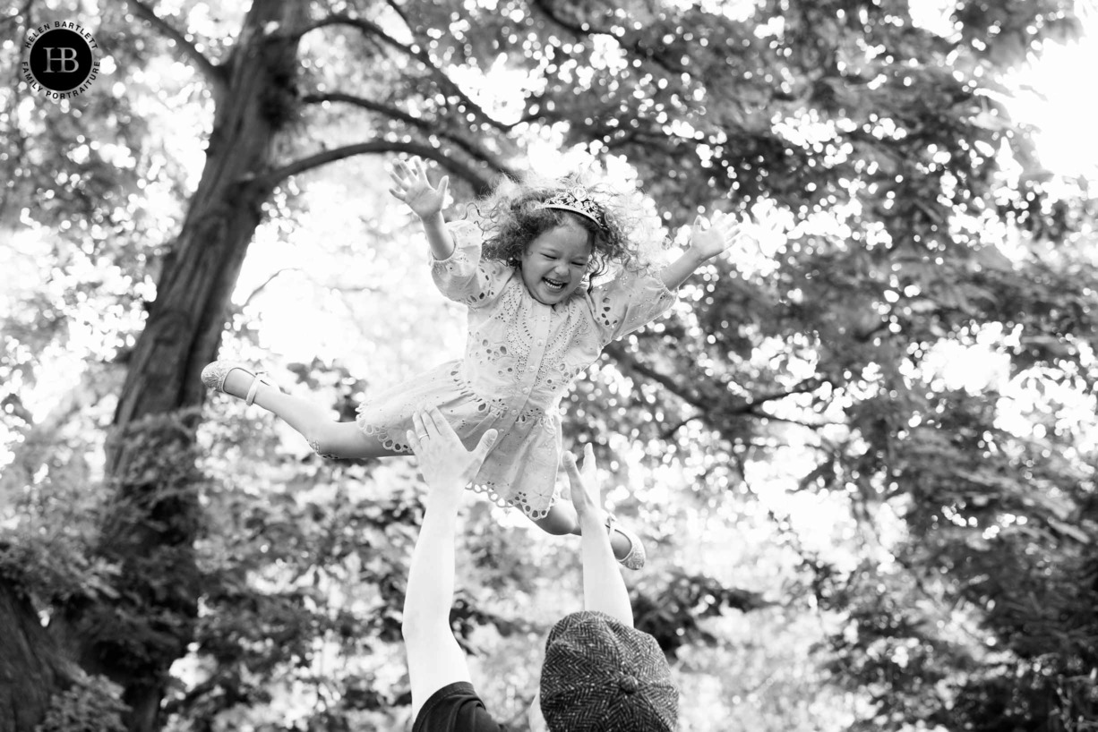 laughing-girl-thrown-in-air