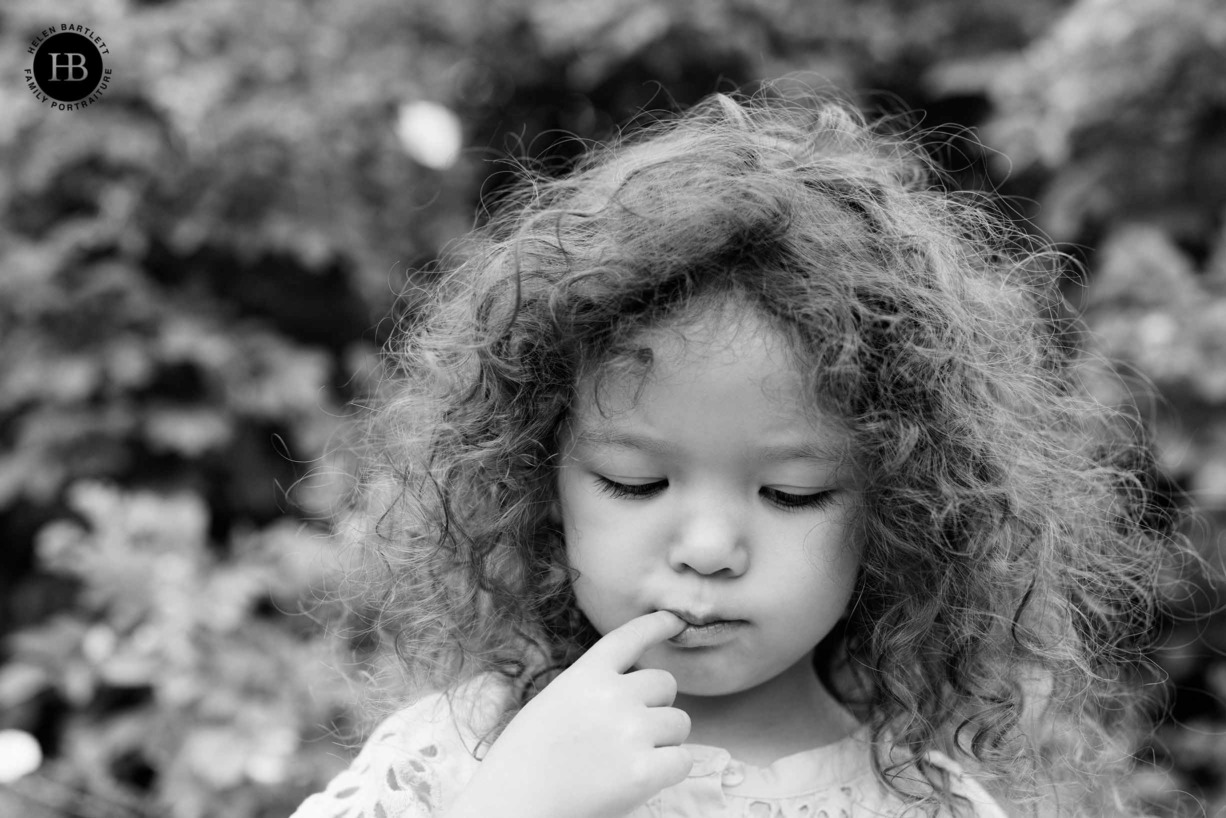 little-girl-looks-pensive-family-photo-shoot