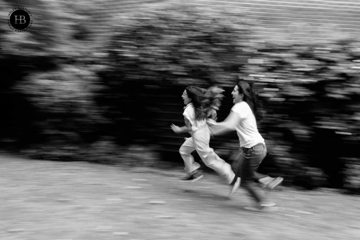 panning-shot-laughing-girls-play-chase