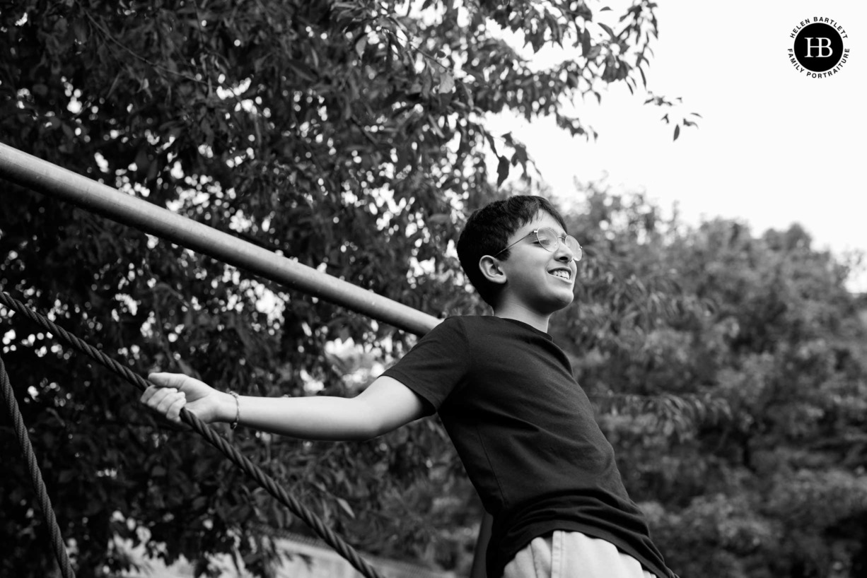 teenage-boy-plays-on-swing