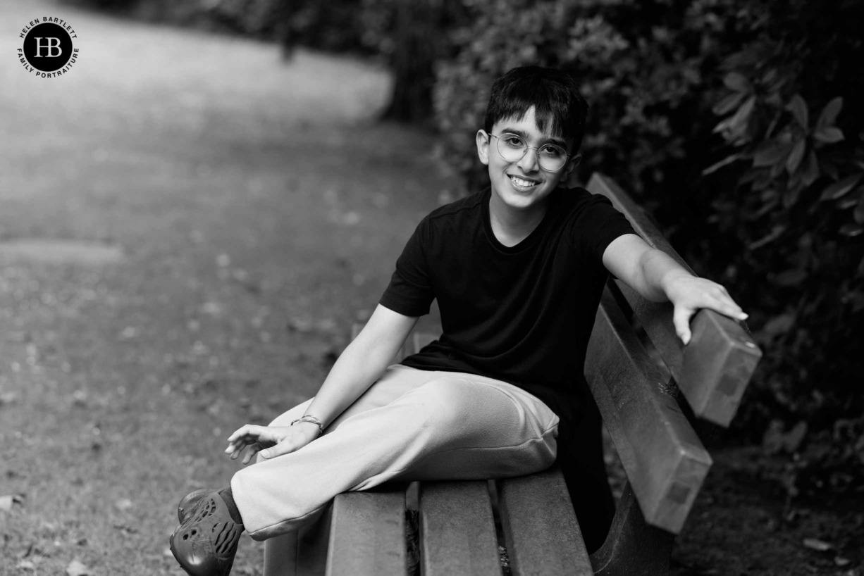 young-teenage-boy-sitting-on-bench