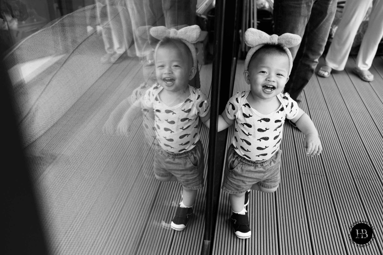 happy-boy-photographed-balcony