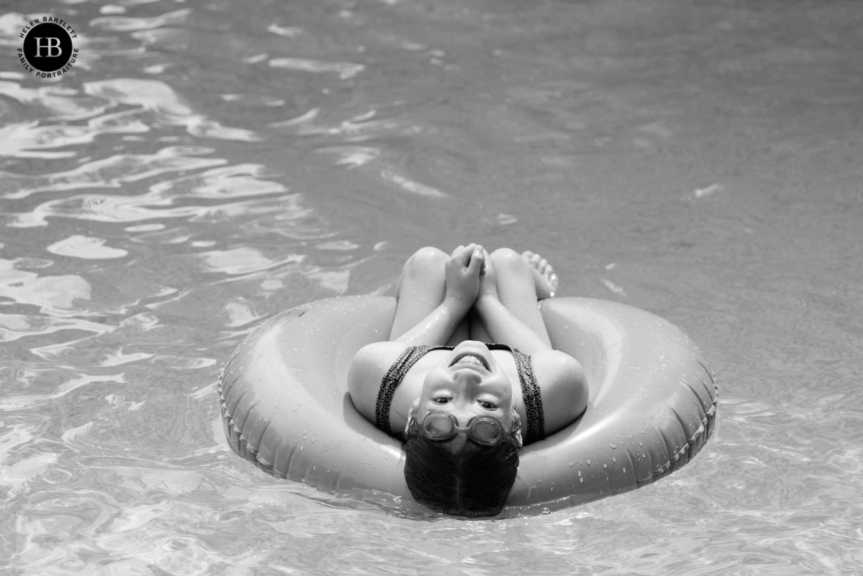happy-girl-floating-rubber-ring-swimming-pool