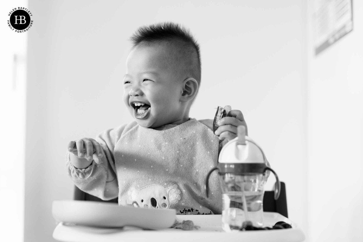 laughing-boy-in-high-chair