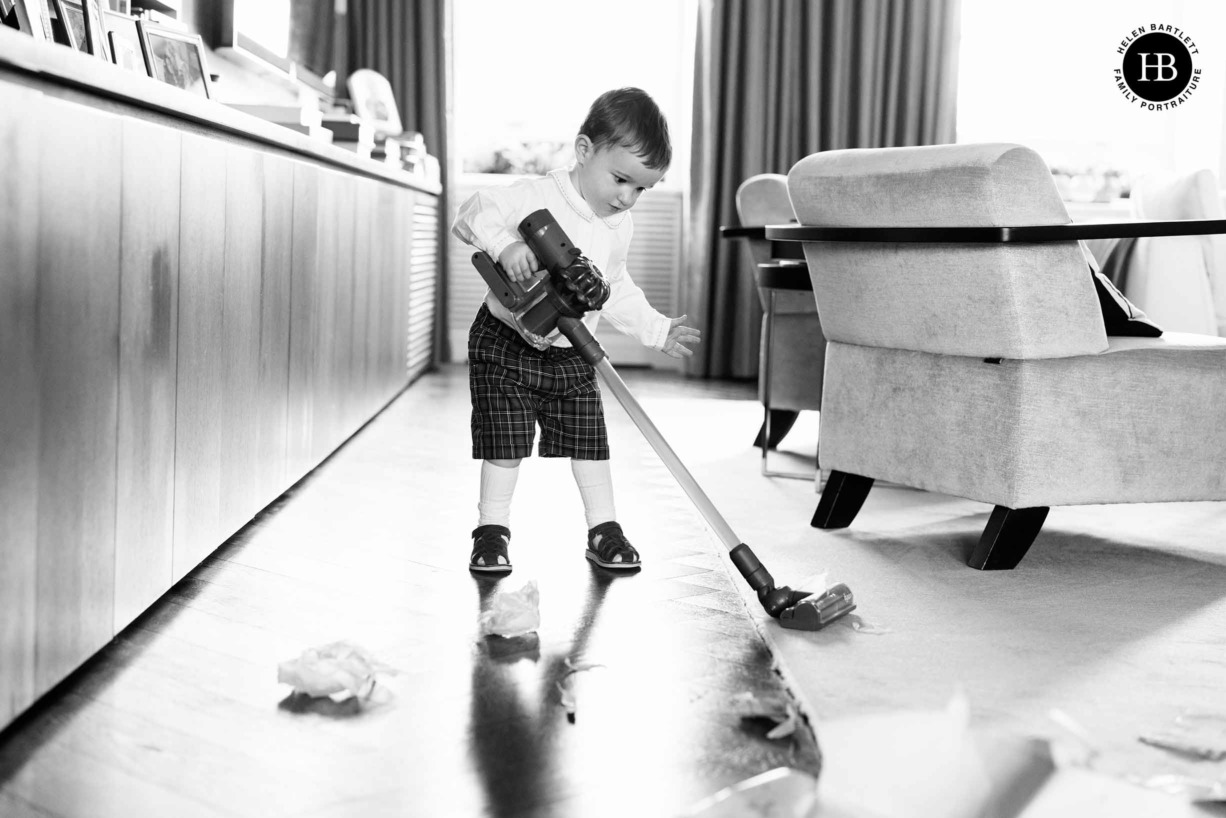 little-boy-plays-toy-hoover