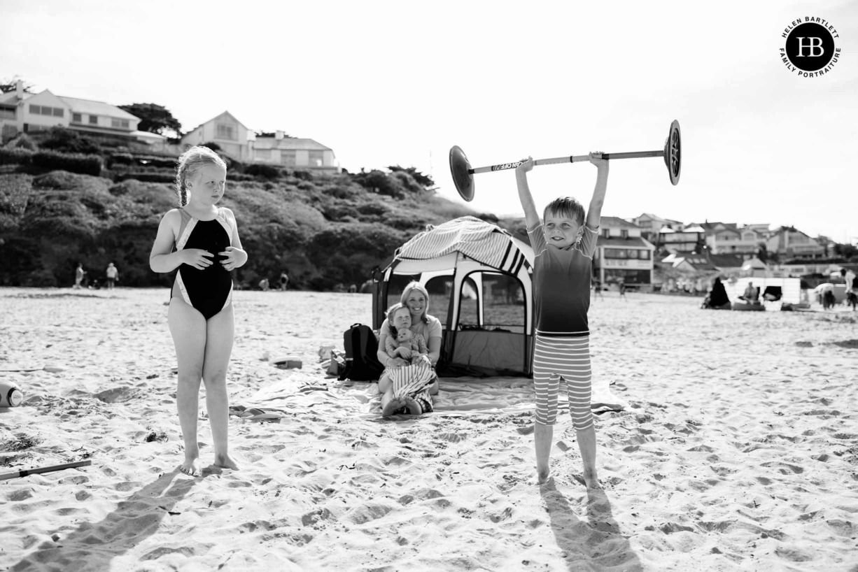 child-pretends-to-weight-lift-polzeath