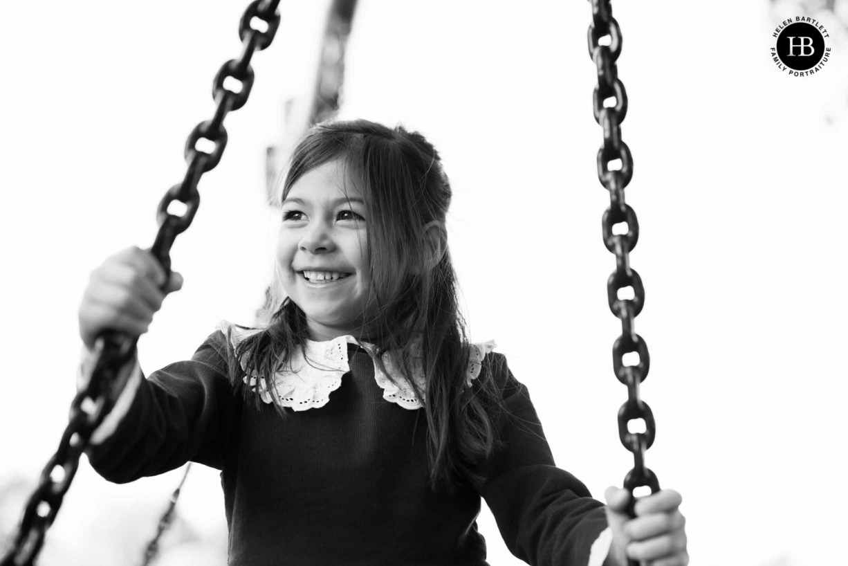 laughing-girl-plays-swing