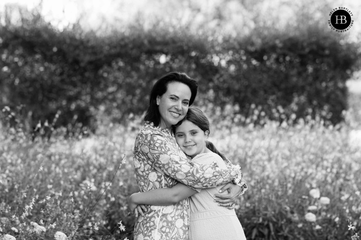 mother-daughter-hug-flowers