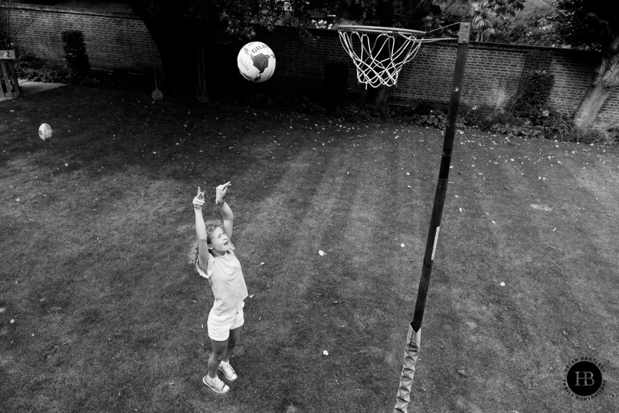 teenage-girl-shoots-at-netball-hoop