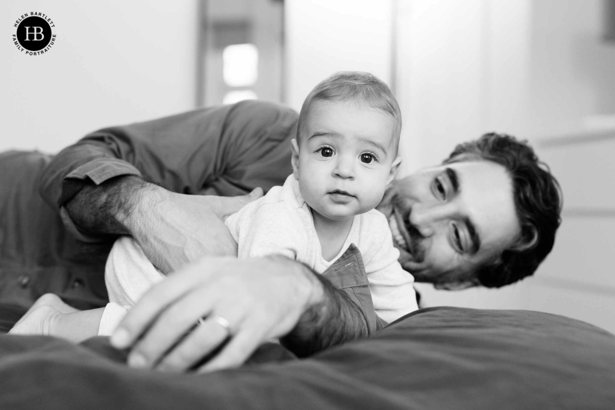 father-and-baby-play-on-bed