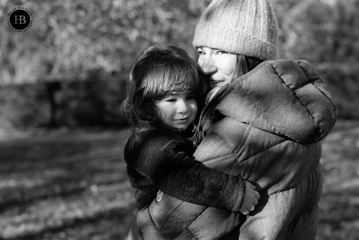 mother-and-son-hug-in-low-winter-sunshine