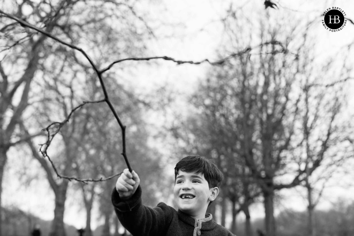 little-boy-plays-stick-family-photo-shoot-hyde-park