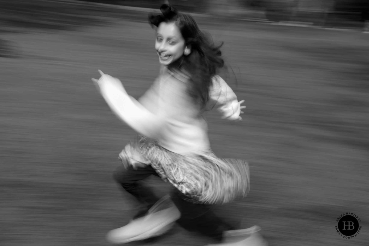 girl-plays-in-park-panning-photo