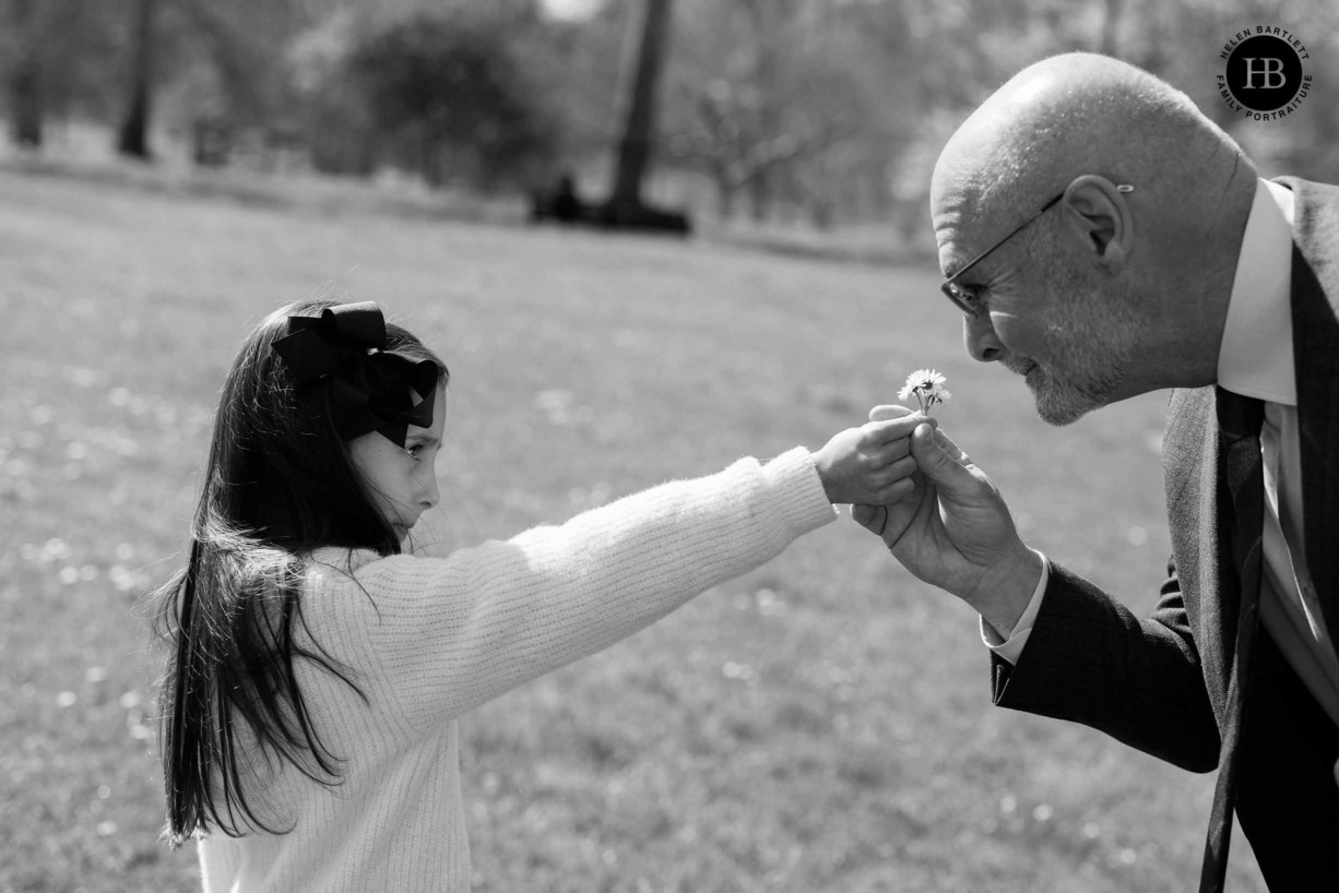 little-girl-shows-grandfather-daisies-st-james-park